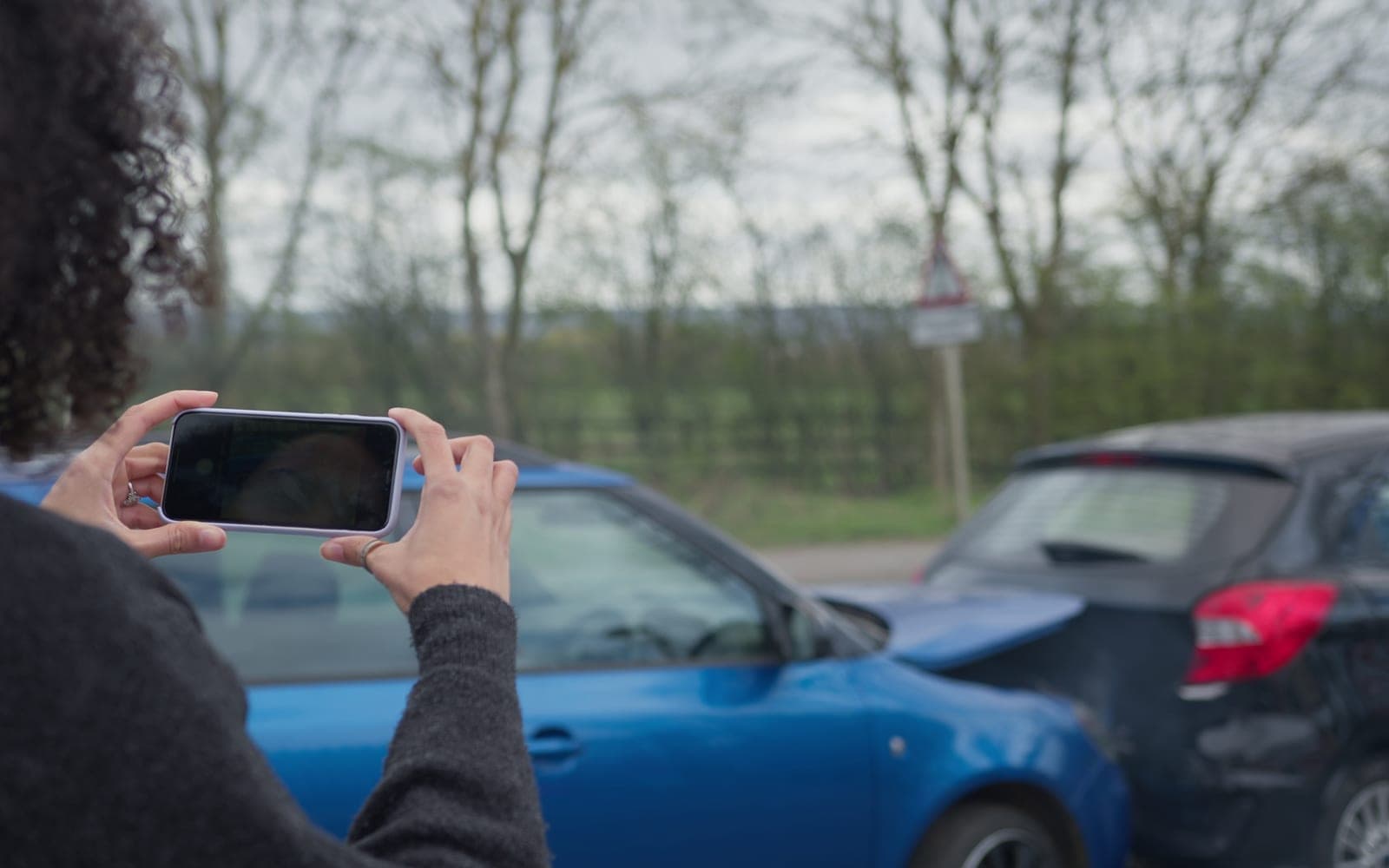 Independent professional documenting completed work with a phone